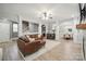 Open-concept living room, showing seamless transitions between living, dining, and kitchen areas at 13032 Windy Lea Ln, Huntersville, NC 28078