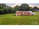 Aerial view of the brick home on a lush, green lot at 133 Jo Monni Loop, Statesville, NC 28625