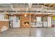 Unfinished basement with a brick fireplace, exposed ductwork, and concrete floors at 133 Jo Monni Loop, Statesville, NC 28625