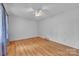 A bright bedroom featuring wood floors, a ceiling fan, and natural light at 133 Jo Monni Loop, Statesville, NC 28625