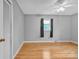 Bright bedroom with wood floors, a ceiling fan, and natural light from a window at 133 Jo Monni Loop, Statesville, NC 28625
