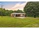 Charming brick home with a metal roof on a large lawn at 133 Jo Monni Loop, Statesville, NC 28625