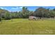 Spacious lot featuring a quaint home surrounded by a large green lawn and mature trees at 133 Jo Monni Loop, Statesville, NC 28625