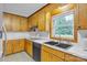 Well-lit kitchen with a double sink, white countertops, and plenty of storage at 133 Jo Monni Loop, Statesville, NC 28625