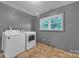 This well-lit laundry room features an updated washer and dryer at 133 Jo Monni Loop, Statesville, NC 28625