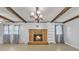 Cozy living room with brick fireplace, wood beams, and decorative lighting at 133 Jo Monni Loop, Statesville, NC 28625