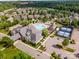 Stunning aerial view of community amenities, including pool, clubhouse, and tennis courts in lush setting at 13407 Hazelbrook Ln, Cornelius, NC 28031