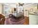 Bright bedroom boasting a four-poster bed, decorative rug, and a ceiling fan for added comfort at 13407 Hazelbrook Ln, Cornelius, NC 28031