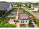 Aerial view of the community garden with plots, a shed, and green space at 13407 Hazelbrook Ln, Cornelius, NC 28031