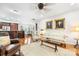 Open-concept living room and kitchen with hardwood floors, neutral colors, and ample seating at 13407 Hazelbrook Ln, Cornelius, NC 28031