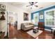 Comfortable living room with hardwood floors, neutral paint, and abundant natural light at 13407 Hazelbrook Ln, Cornelius, NC 28031