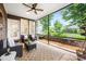 This screened-in patio is perfect for relaxing with outdoor seating and a view of the landscaped yard at 13407 Hazelbrook Ln, Cornelius, NC 28031