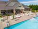 An elevated view of the neighborhood pool with plentiful lounge chairs and covered areas at 13407 Hazelbrook Ln, Cornelius, NC 28031