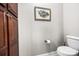 Charming half bathroom with a toilet, storage cabinet, and decorative accents for added style at 13407 Hazelbrook Ln, Cornelius, NC 28031