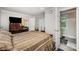 Comfortable bedroom featuring neutral walls, a large bed, and an accessible en-suite bathroom at 1406 W Walnut Ave, Gastonia, NC 28052