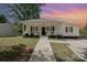 Charming home with a covered front porch, ideal for relaxing and enjoying the neighborhood at 1406 W Walnut Ave, Gastonia, NC 28052