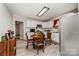 Cozy kitchen with white cabinets, stainless steel appliances, and a dining area for everyday meals at 1406 W Walnut Ave, Gastonia, NC 28052