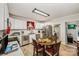 Bright kitchen featuring white cabinetry, stainless steel appliances, and cozy dining area at 1406 W Walnut Ave, Gastonia, NC 28052