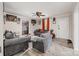 Relaxing living room with lots of seating and a large ceiling fan, perfect for entertaining guests at 1406 W Walnut Ave, Gastonia, NC 28052