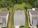 Aerial view of a home featuring a well-manicured lawn with garden beds and surrounding greenery at 1409 Tupelo Rd, Clover, SC 29710