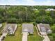 An aerial view of well-maintained homes boasting lush green lawns and mature trees at 1409 Tupelo Rd, Clover, SC 29710
