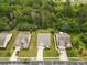 An aerial view of a neighborhood showcasing well-maintained homes, lush trees, and green lawns at 1409 Tupelo Rd, Clover, SC 29710