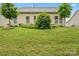 A home's backyard featuring a well-kept lawn, beautiful greenery, and mature landscaping at 1409 Tupelo Rd, Clover, SC 29710