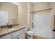 Bathroom with granite countertops, ample cabinet space, a toilet, and a shower-tub combo at 1409 Tupelo Rd, Clover, SC 29710