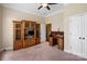 This bedroom features neutral colored walls, carpet, built-in shelving and a ceiling fan at 1409 Tupelo Rd, Clover, SC 29710