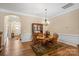 Open dining room with hardwood floors and stylish furnishings, seamlessly connected to the living space at 1409 Tupelo Rd, Clover, SC 29710