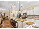 Kitchen boasts granite counters, stainless steel appliances, a large island, and easy access to dining area at 1409 Tupelo Rd, Clover, SC 29710