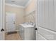 This laundry room features a washer, dryer and shelving at 1409 Tupelo Rd, Clover, SC 29710