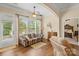 Cozy living room with hardwood flooring has easy access to the backyard and the primary bedroom at 1409 Tupelo Rd, Clover, SC 29710