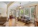 Living room boasts ample natural light with large windows and leads to a cozy dining area at 1409 Tupelo Rd, Clover, SC 29710