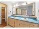 Vintage bathroom featuring double sinks, ample counter space, and a classic mirror at 1513 Shelby Hwy, Cherryville, NC 28021
