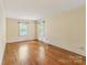Spacious bedroom with hardwood floors and dual windows providing plenty of natural light at 1513 Shelby Hwy, Cherryville, NC 28021