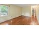 Large bedroom with wood floors and natural light from a window, creating a bright and airy feel at 1513 Shelby Hwy, Cherryville, NC 28021