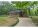 Charming two-story home featuring brick accents and a sunroom with abundant windows at 1513 Shelby Hwy, Cherryville, NC 28021
