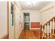 Bright foyer with hardwood floors, staircase, and multiple doors creating a welcoming entrance at 1513 Shelby Hwy, Cherryville, NC 28021