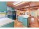 This kitchen has an open design, wooden beam ceilings, and adjoins a breakfast area, creating a cozy atmosphere at 1513 Shelby Hwy, Cherryville, NC 28021