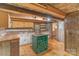 Kitchen with rustic log walls, wooden countertops, and a small island at 1513 Shelby Hwy, Cherryville, NC 28021