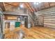 Open-concept living area with a kitchen island and staircase to a loft at 1513 Shelby Hwy, Cherryville, NC 28021