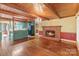 Inviting living room with hardwood floors, brick fireplace, and chandelier, perfect for gatherings at 1513 Shelby Hwy, Cherryville, NC 28021