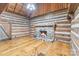 Cozy living room with a stone fireplace and hardwood floors at 1513 Shelby Hwy, Cherryville, NC 28021