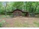 Rustic outbuilding featuring wooden design, covered areas, and antique signage at 1513 Shelby Hwy, Cherryville, NC 28021