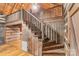 Wooden staircase leading to the loft area with a rustic design at 1513 Shelby Hwy, Cherryville, NC 28021
