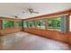 The sunroom boasts brick flooring, and large windows, creating a serene indoor-outdoor experience at 1513 Shelby Hwy, Cherryville, NC 28021