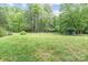 Vast green lawn with scattered trees and outbuildings, highlighting spacious outdoor area at 1513 Shelby Hwy, Cherryville, NC 28021