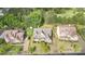 Aerial view of a well-manicured property showcasing a home with lush landscaping and mature trees at 15637 Guthrie Dr, Huntersville, NC 28078