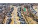 An aerial view displays the meticulously planned community and its attractive homes, pond, and cul-de-sac at 15637 Guthrie Dr, Huntersville, NC 28078